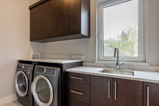 Laundry room with under counter washer and dryer.